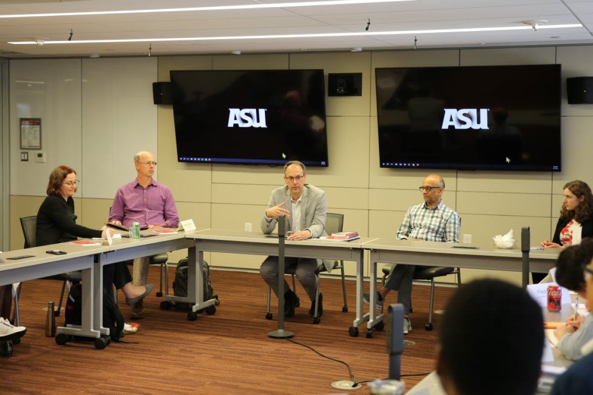 People sitting around a conference table