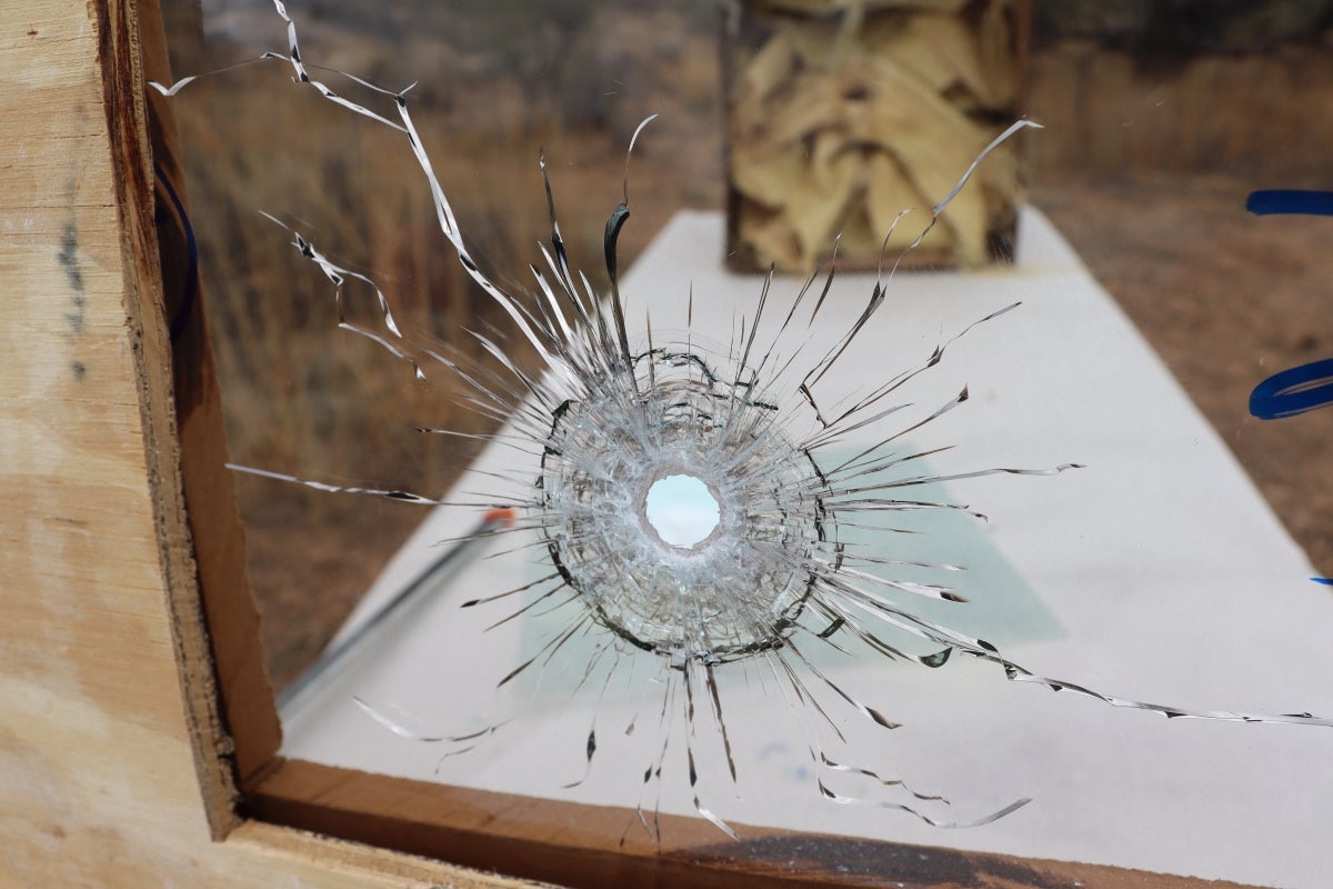 Photo of a glass that has been shattered by a bullet