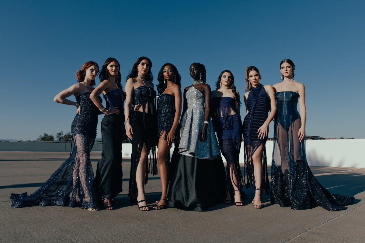 Several women pose in evening dresses