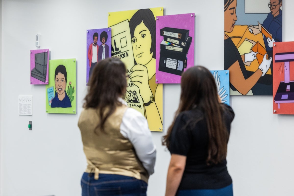 Two women looking at art