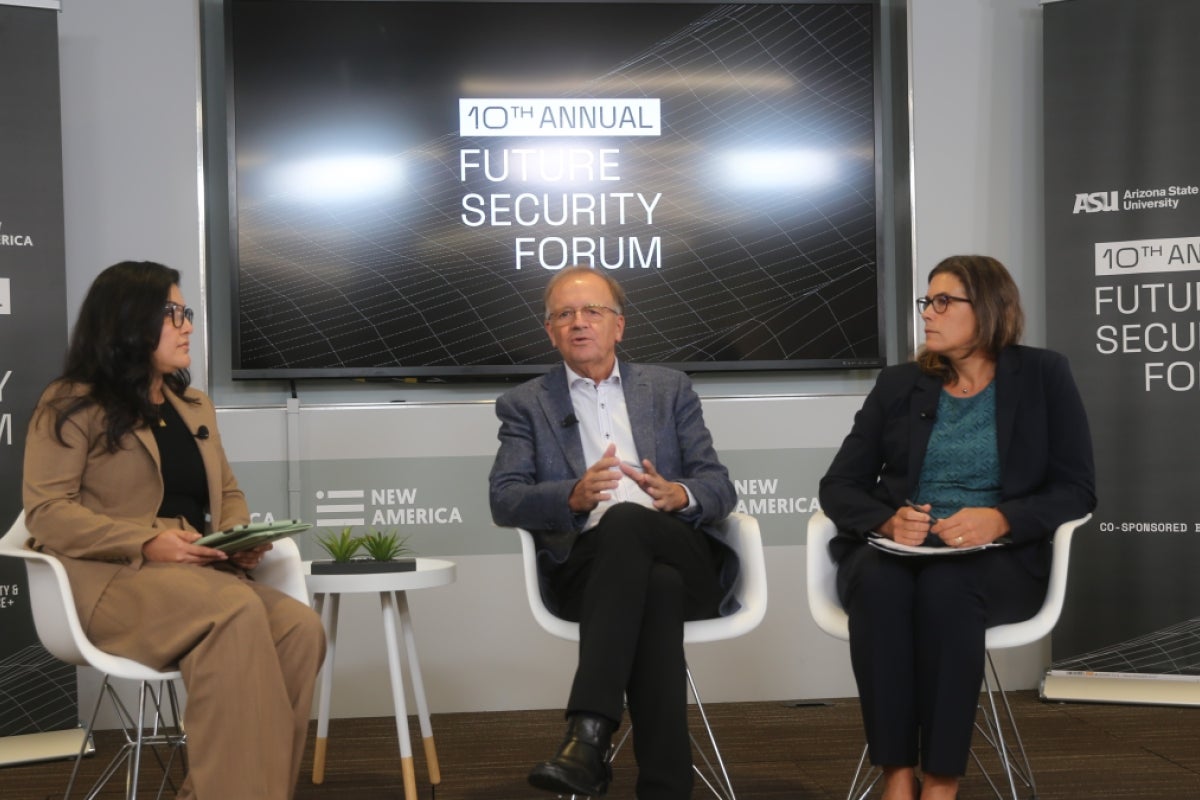 Three people seated in a room