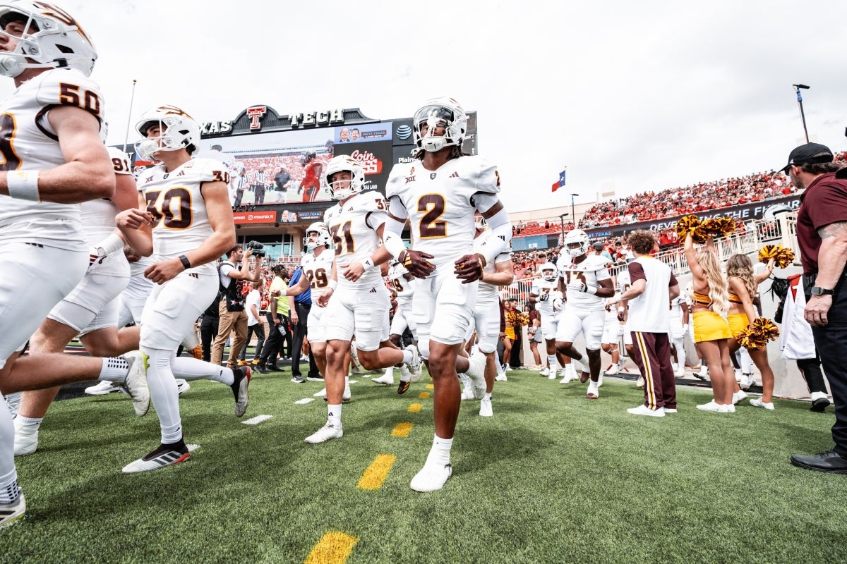 ASU football players run out onto the field at Texas Tech