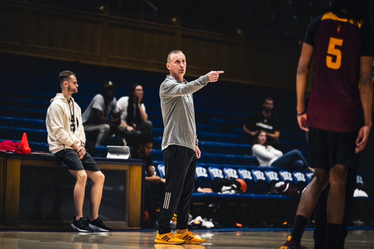 ASU basketball coach Bobby Hurley gestures to players during practice