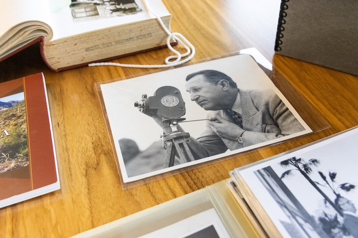 Black-and-white photo of a man on a table.