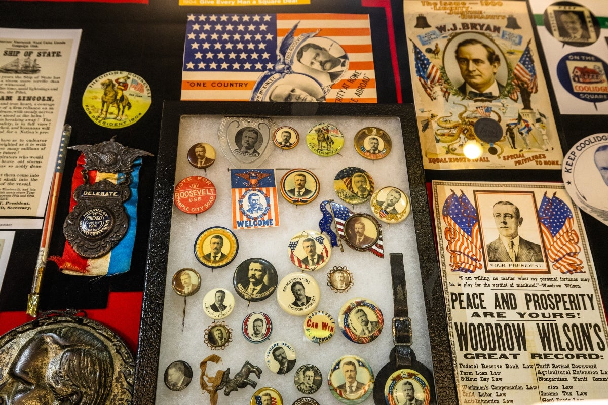 Display case of historical presidential campaign buttons