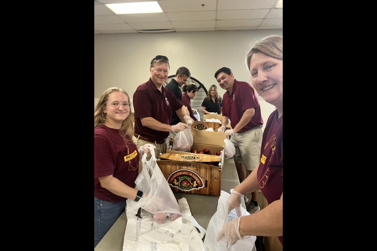 Staff and faculty from the School of Geographical Sciences and Urban Planning volunteer at St. Mary's Food Bank.