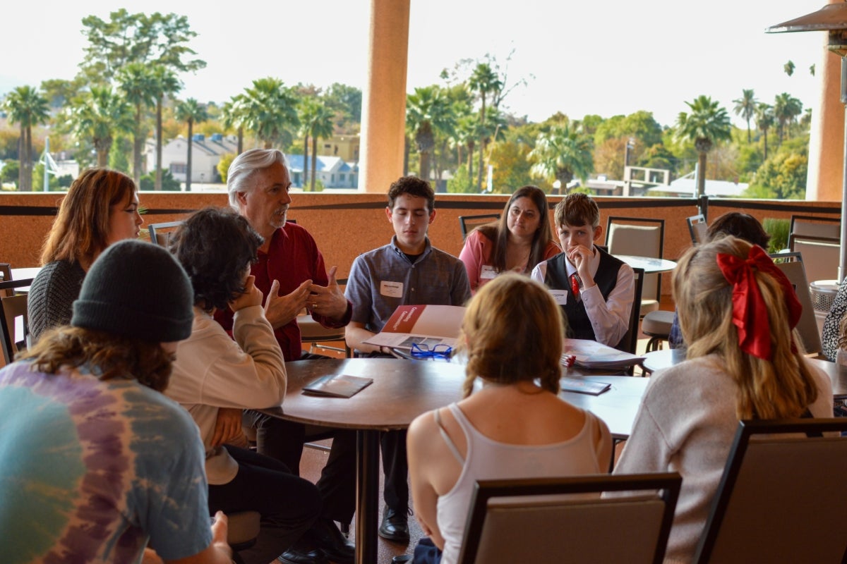 Photo of students speaking with ASU Gammage staff. 