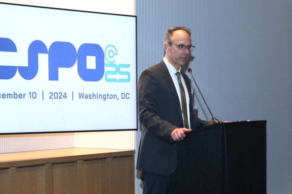 Arthur Daemmrich speaks from a lectern