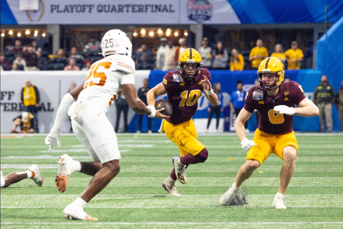 ASU players run a play at the Peach Bowl against Texas