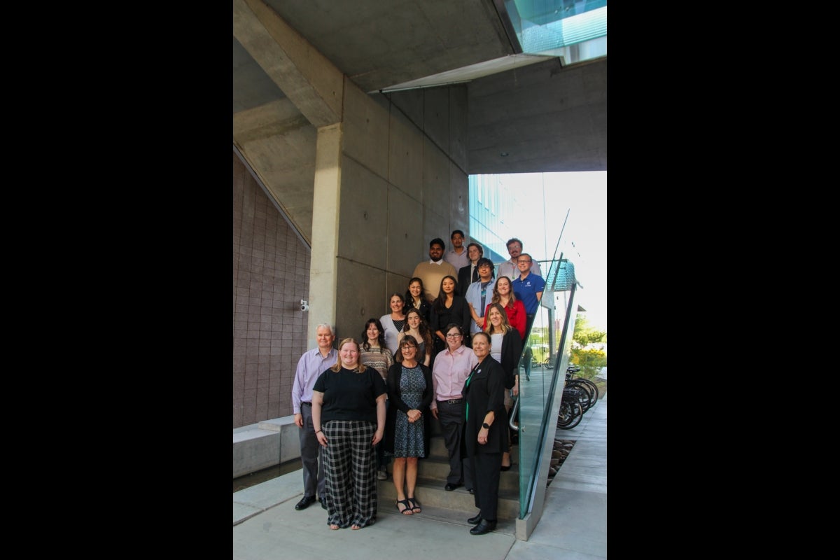 Group photo of students, faculty and staff from ASU and Arizona municipalities taken in the stairwell of the Walton Center for Planetary Health