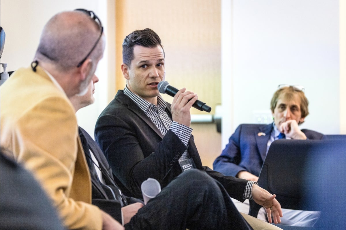 A man speaks into a microphone