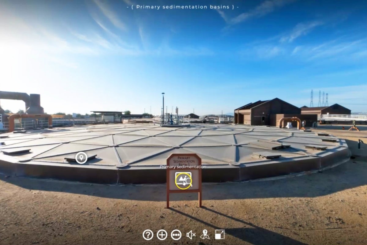 An outdoor view of the AWP plant showing a sedimentation basin with an interactive element viewers can click on for more information.