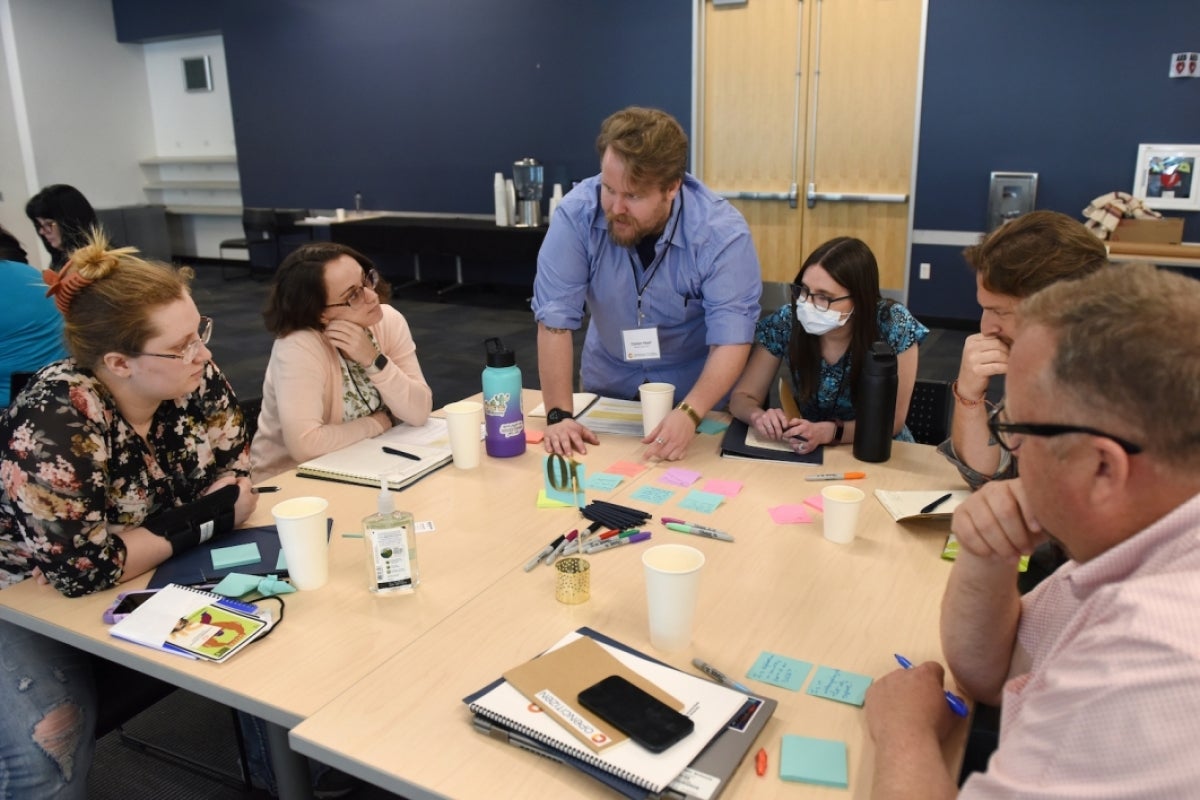 A group works together at the OpenCitizen Gathering.