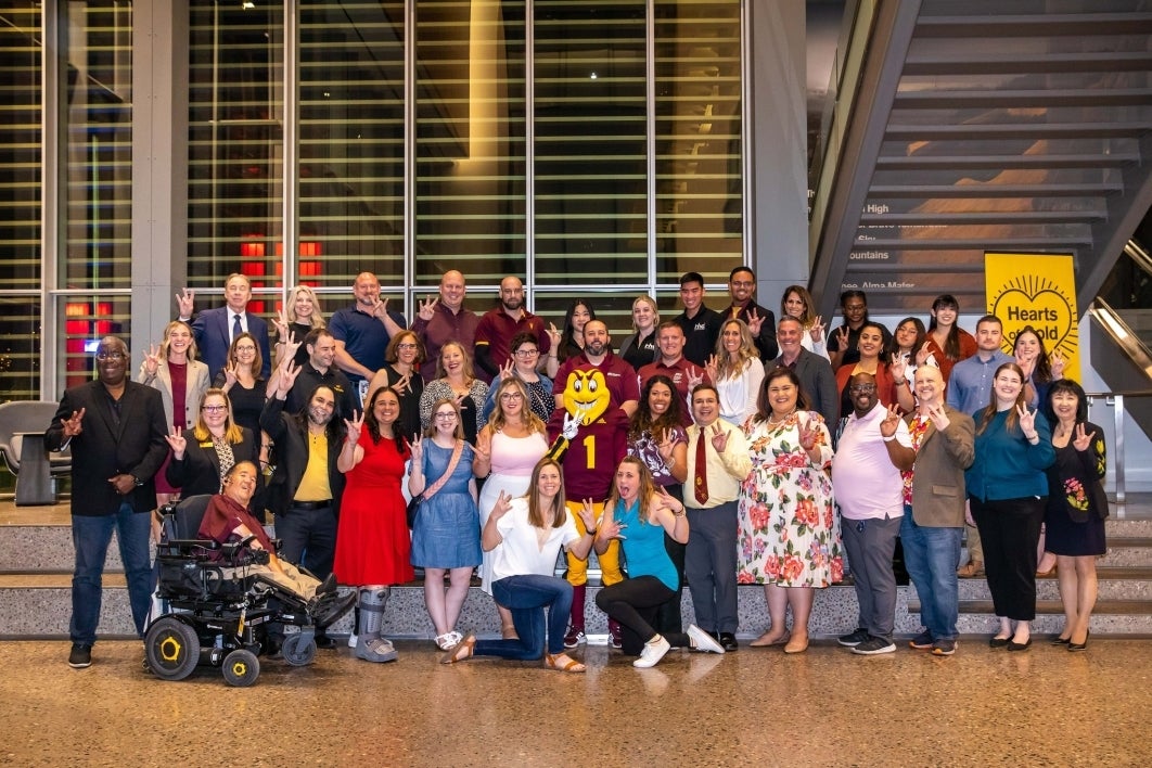 2023 Affinity Reunion goers pose for a photo together.