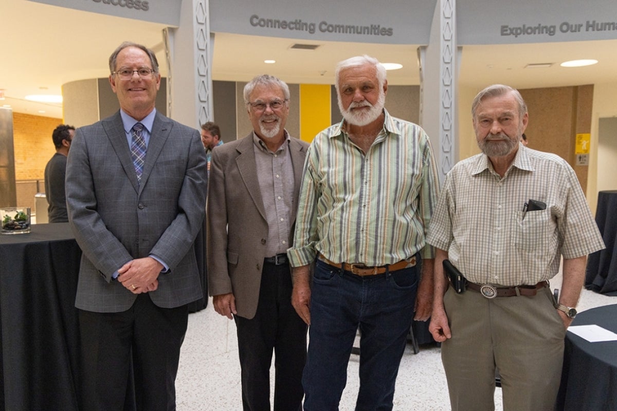 Dean Patrick Kenny, Robert Page, Bob Johnson and Bert Hölldobler smile at the camera.