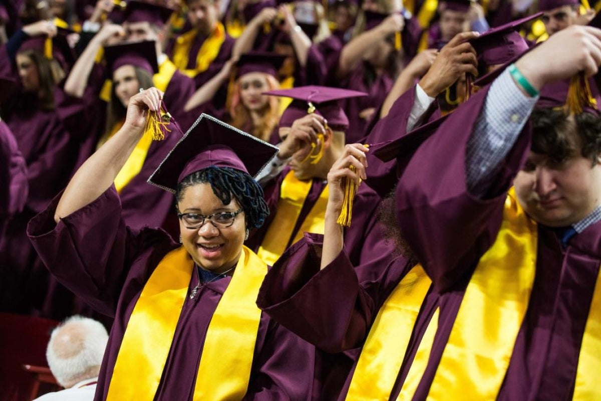 graduates moving their tassels at commencement