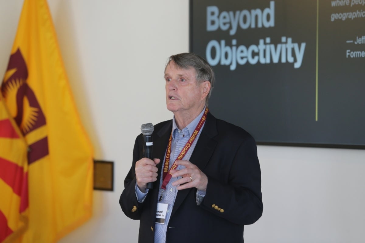 Leonard Downie Jr. speaking at an event.