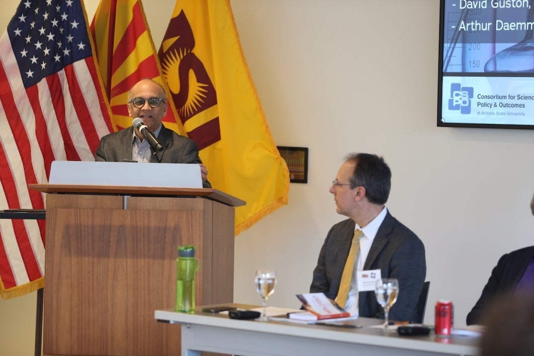 ASU policy experts at a table and podium discussing science and legislation