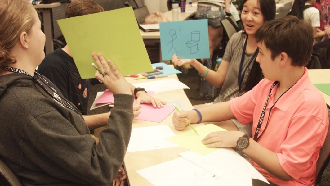 Students at the Chief Science Officers (CSO) Summer Institute sketch pages for a 