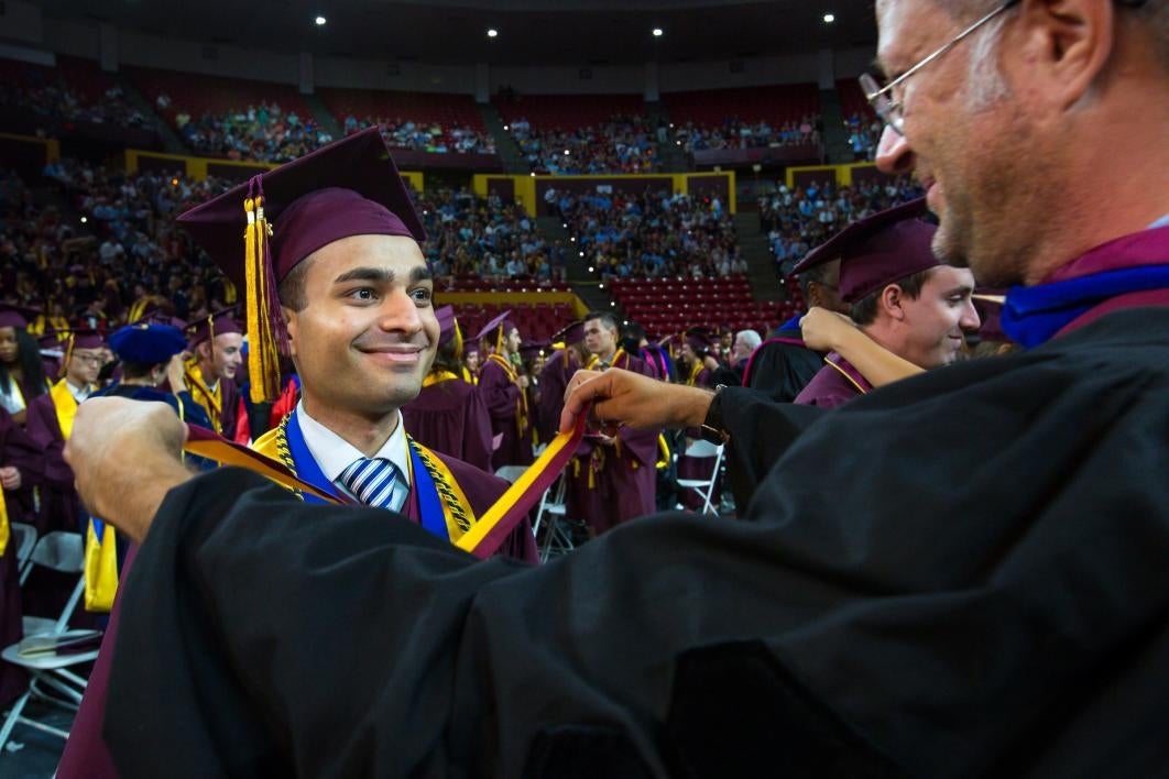 graduate receiving medallion