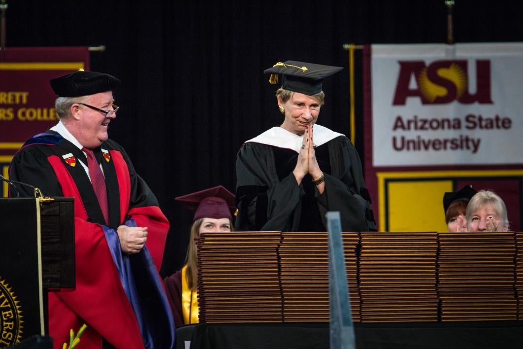 two people on stage at convocation