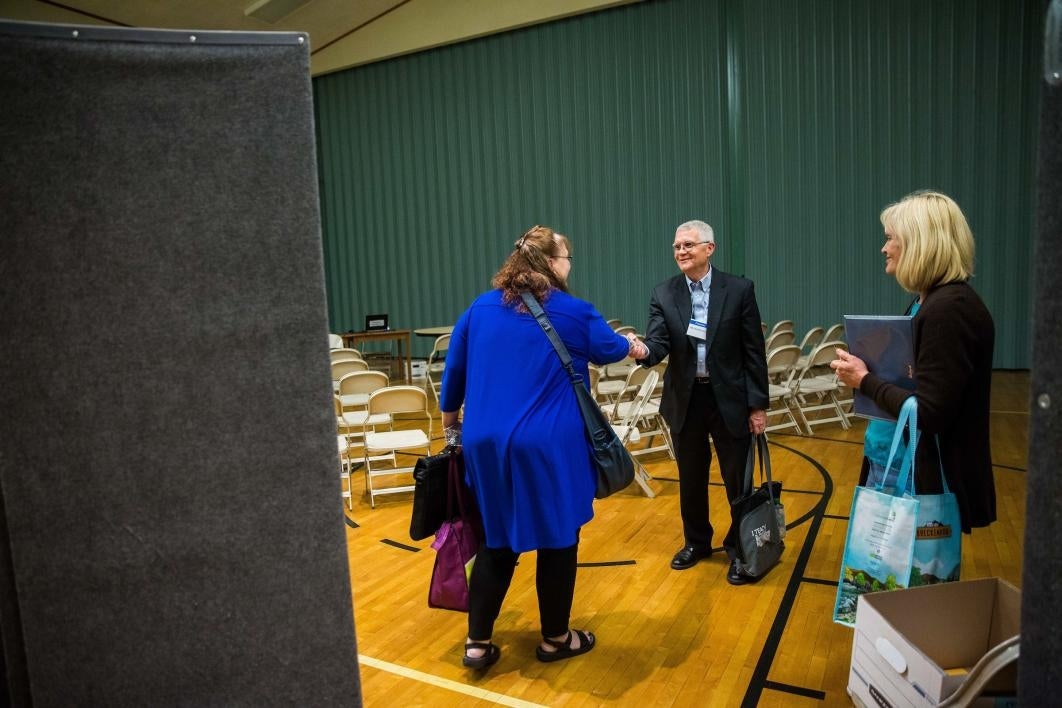 Dean Roen greets guests