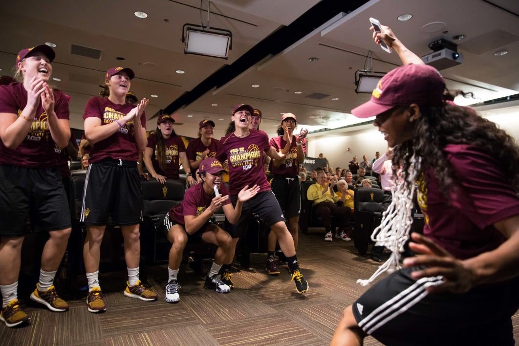 womens basketball team celebrates