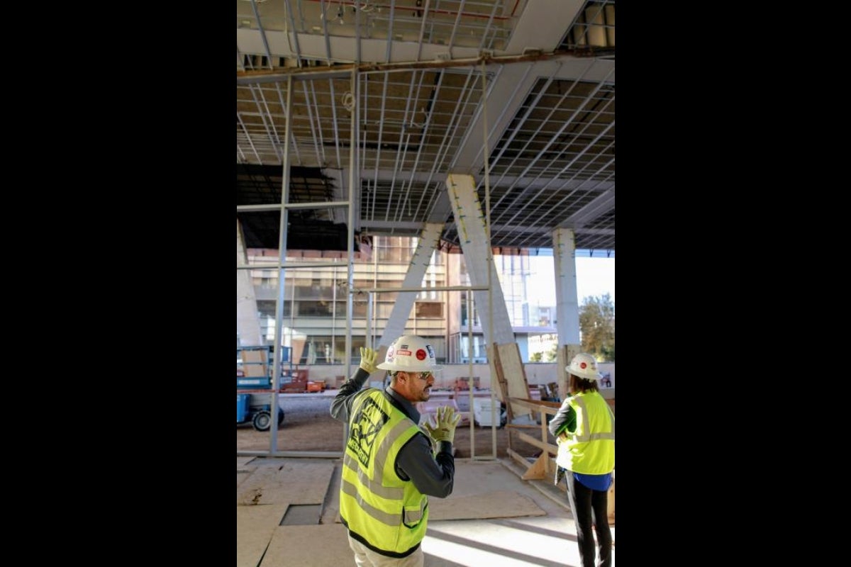 McCarthy Construction project manager Carlos Diaz leads a tour