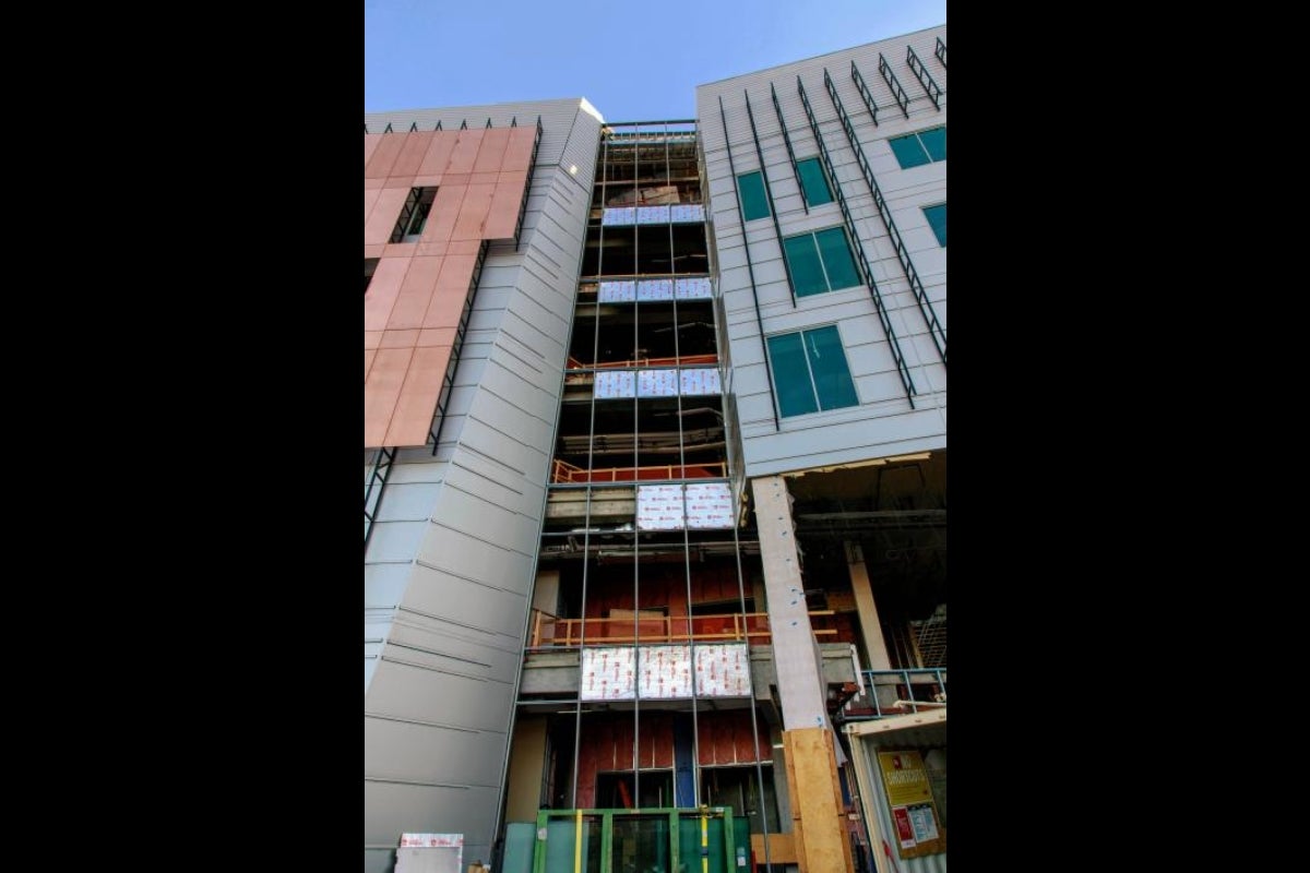 Above ground, floor-to-ceiling windows and copper paneling will soon fill in the building exterior