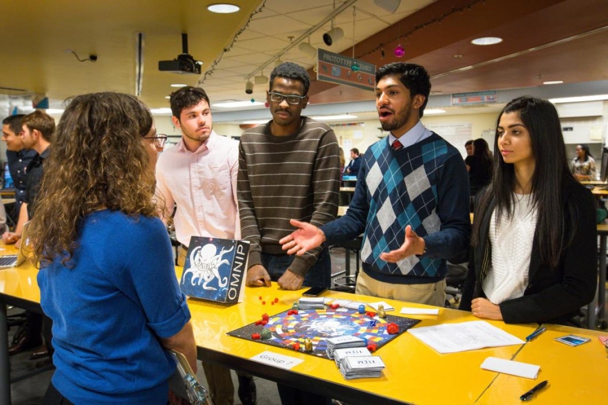 Students pitch their idea for a board game.