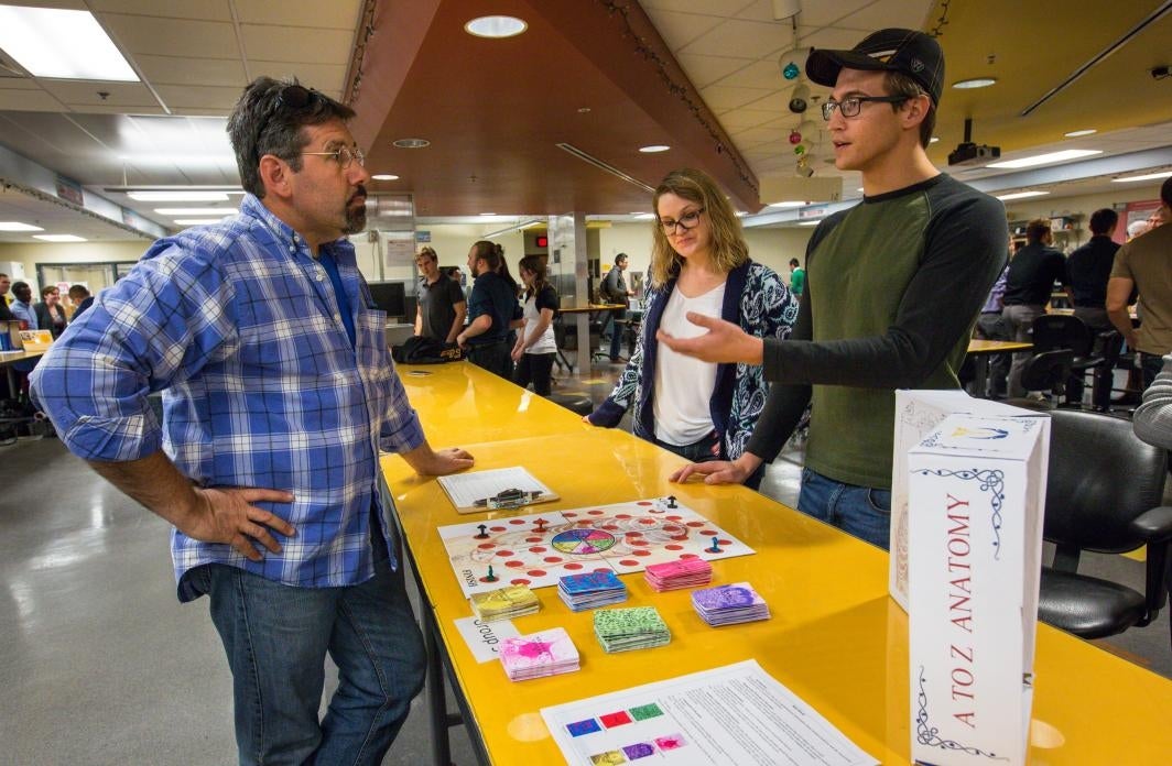 Students speak about the board game they created.