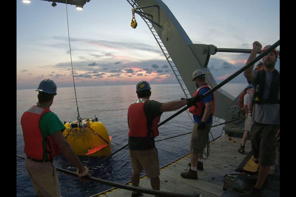 men on a boat in the ocean