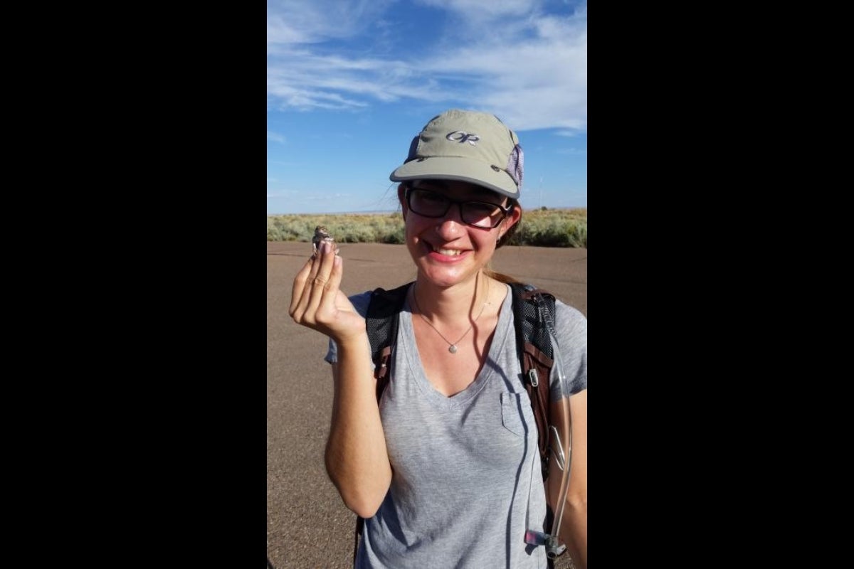 ASU student Lindsay Boyd holding lizard