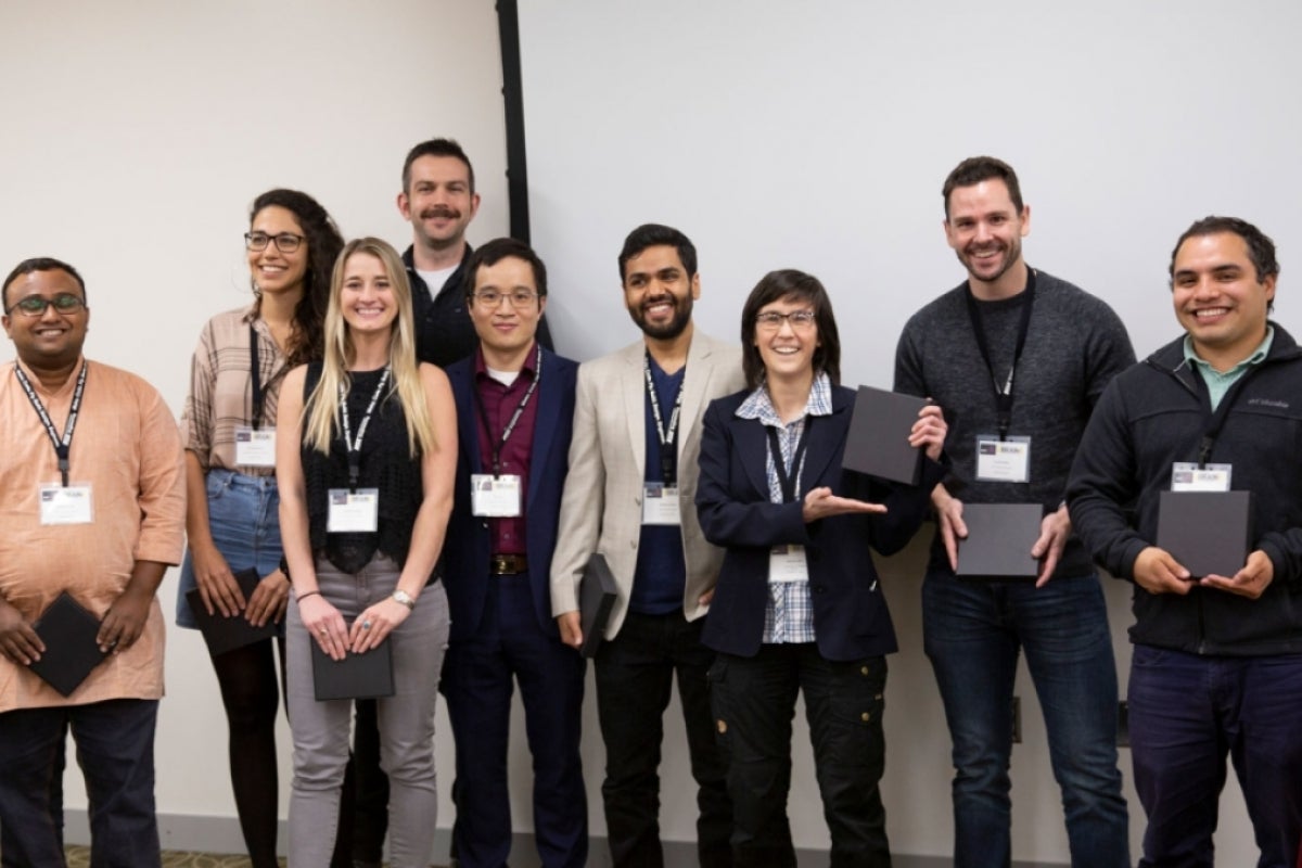 Students from the top three teams pose with their awards.