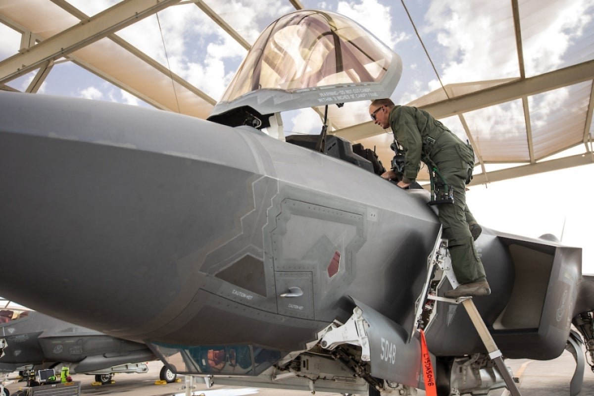 Pilot climbs into F-35