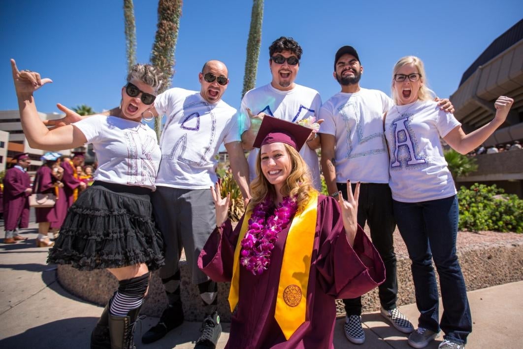 group wearing grad's name on their shirts