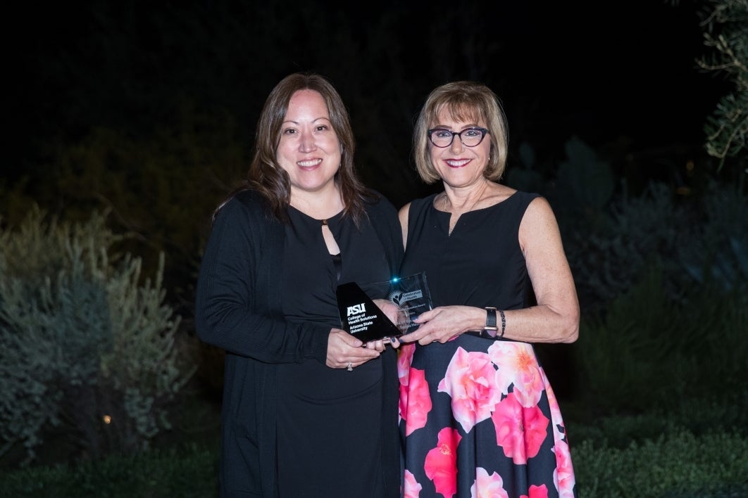 Kimberly McWilliams (right) of Terros Health with College of Health Solutions Dean Deborah Helitzer.