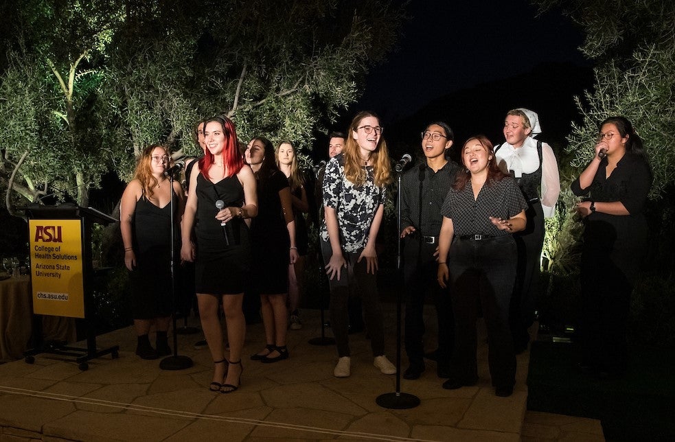 Members of Arizona State University's Devil Clefs acapella group perform at the Celebration of Health event.