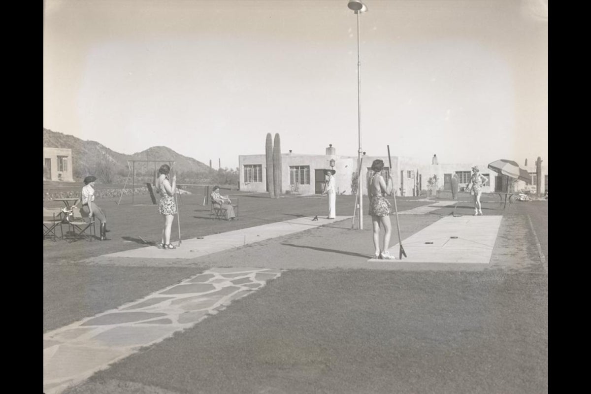 Women playing shuffleboard.