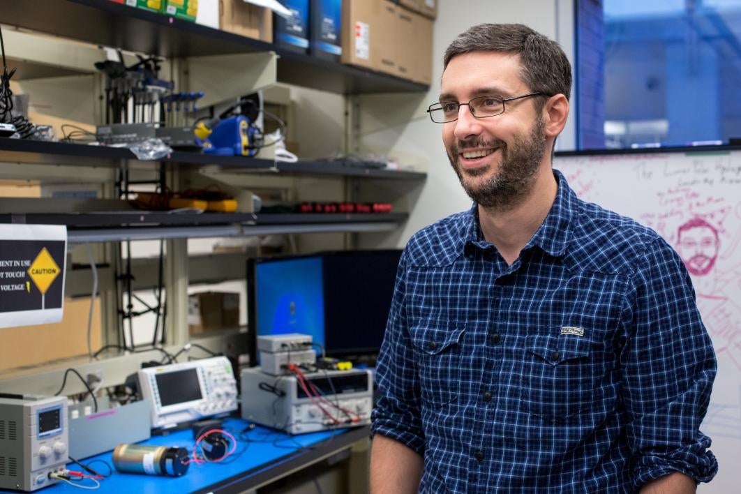 A spacecraft designer is interviewed in his lab