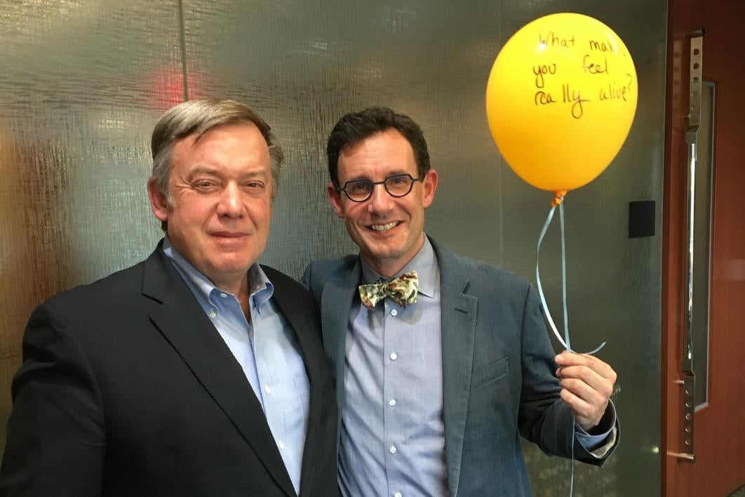 President Crow and Dean Tepper with a balloon