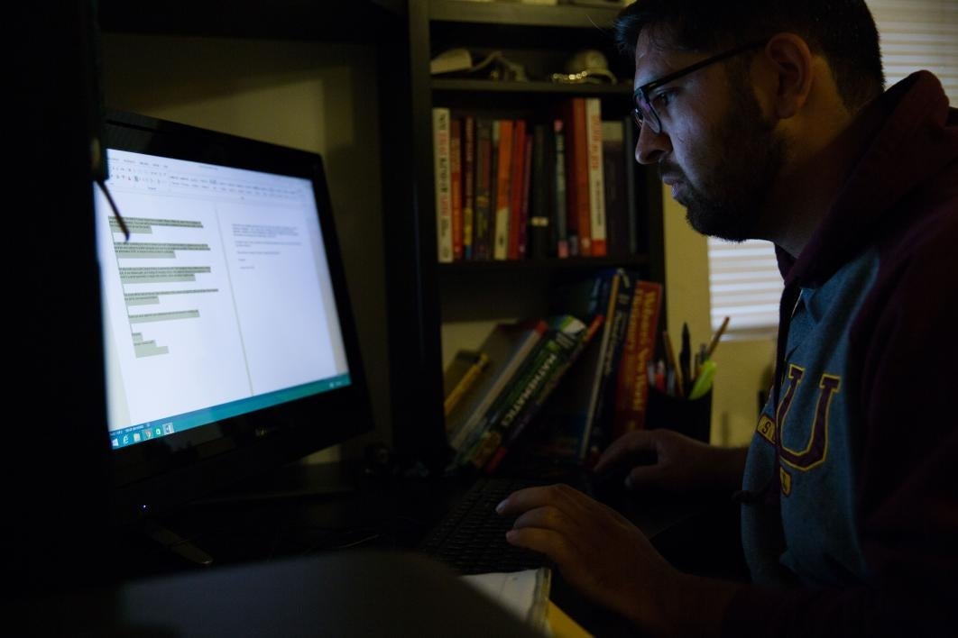 man looking at computer