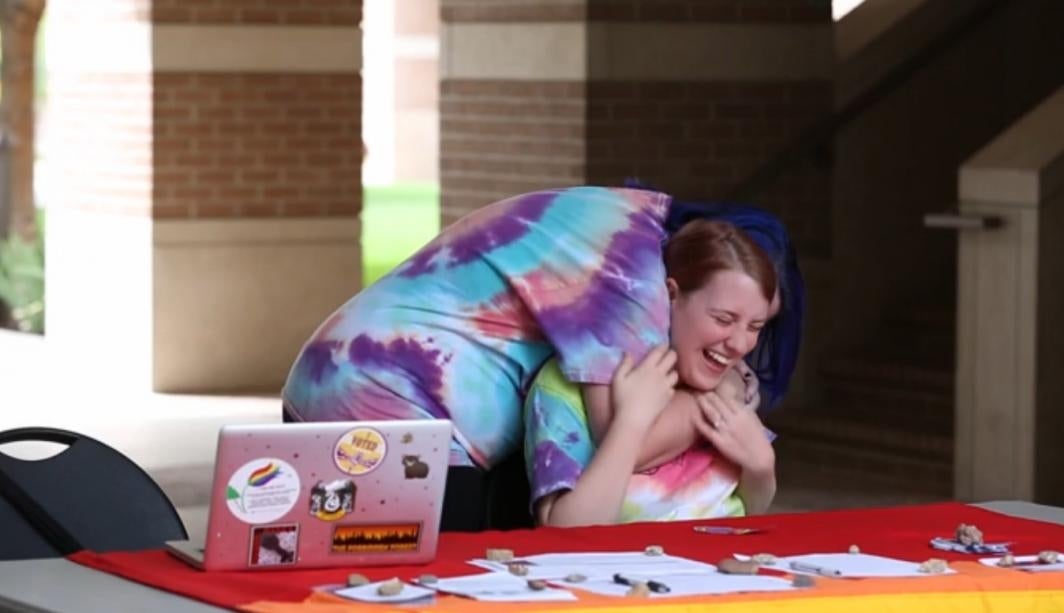 woman smiling being hugged