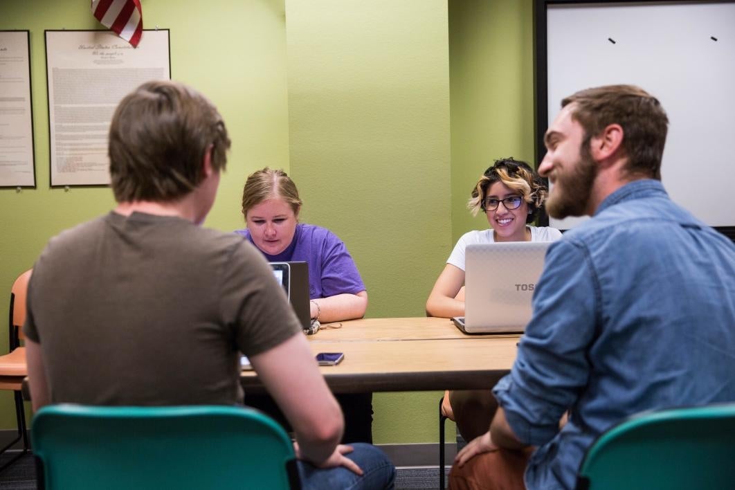 students speaking in a classroom