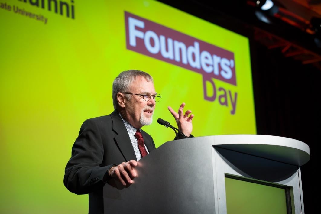 Robert Page speaks at a lectern