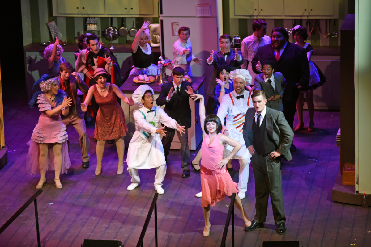 A group of performers in costume during a show.