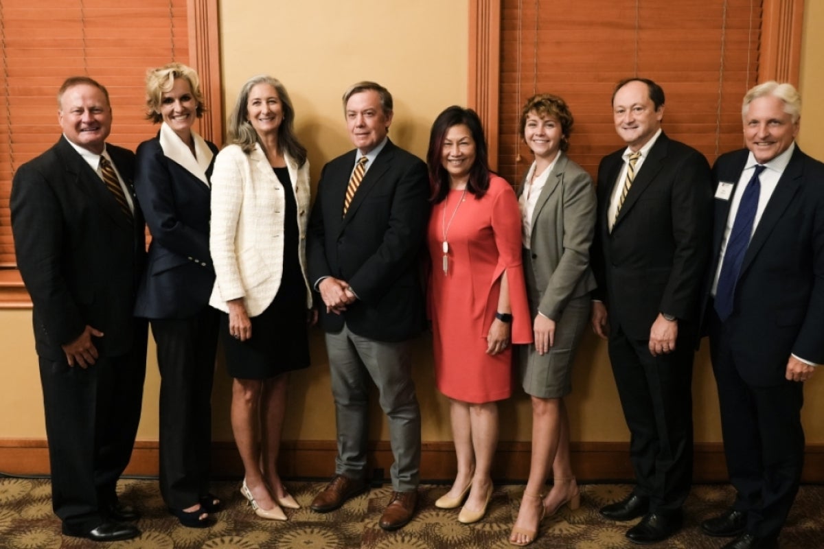 A group of people pose for a photo