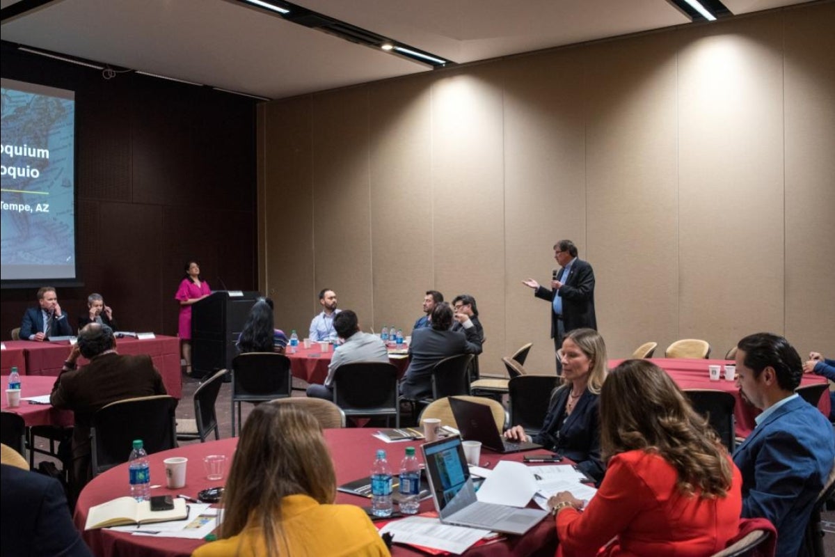 Audience members engage with colloquium panelists about barriers facing cross-border research, and possible pathways to overcome them. 