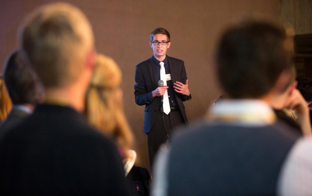 A man speaks to a crowd.