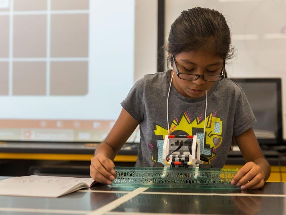 Girls build robots at Lego camp